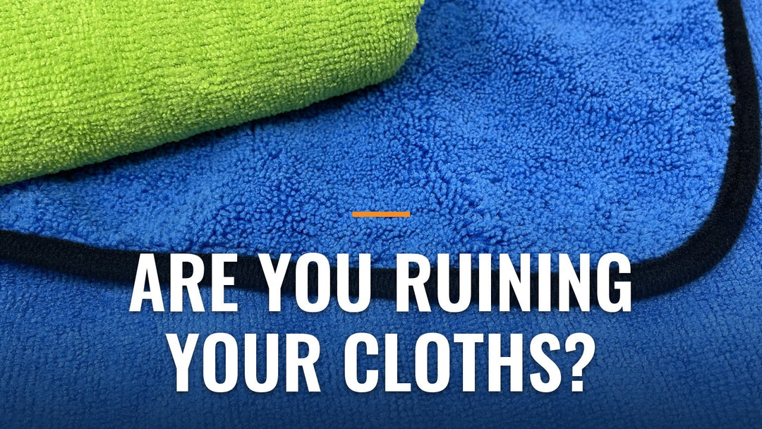 Close-up of folded green and blue microfiber cloths showing the plush texture, with the words "Are You Ruining Your Cloths?"