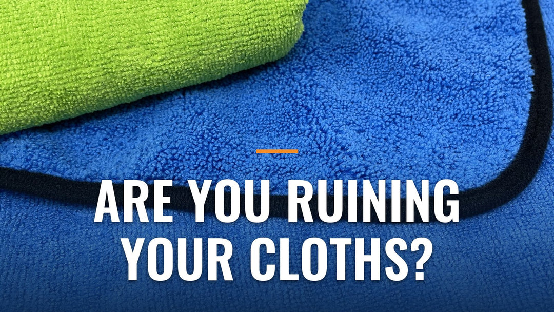 Close-up of folded green and blue microfiber cloths showing the plush texture, with the words "Are You Ruining Your Cloths?"